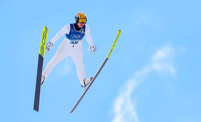 Jens Luraas Oftebro, of Norway, soars through the air during his competition round jump of the nordic combined individual Gundersen large hill/10km at the 2026 Winter Olympics, in Predazzo, Italy, Tuesday, Feb. 17, 2026. (AP Photo/Kirsty Wigglesworth)