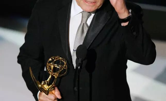 FILE - Robert Duvall accepts the award for outstanding lead actor in a miniseries or a movie for his work on "Broken Trail" at the 59th Primetime Emmy Awards in Los Angeles on Sept. 16, 2007. (AP Photo/Mark J. Terrill, File)