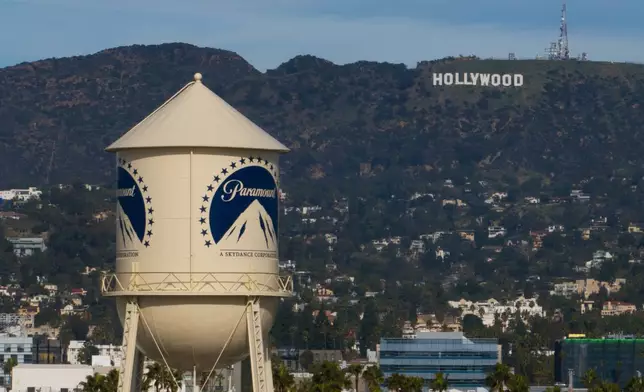 FILE - The Paramount Pictures water tower is seen in Los Angeles, Dec. 18, 2025, with the Hollywood sign in the distance. (AP Photo/Jae C. Hong, File)