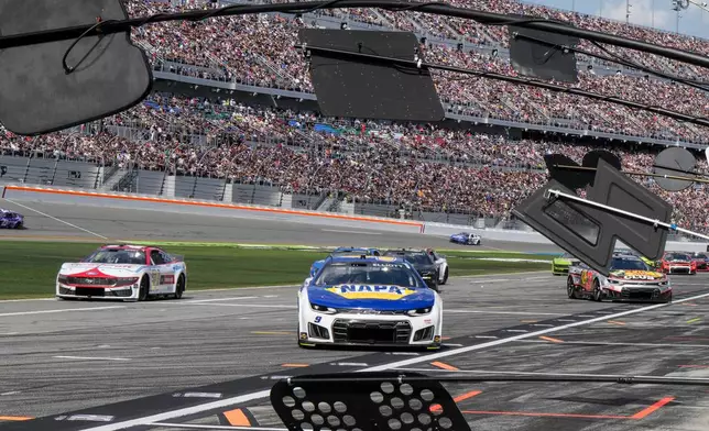 Chase Elliott moves toward the pitt during the NASCAR Daytona 500 auto race at Daytona International Speedway, Sunday, Feb. 15, 2026, in Daytona Beach, Fla. (AP Photo/Nigel Cook)