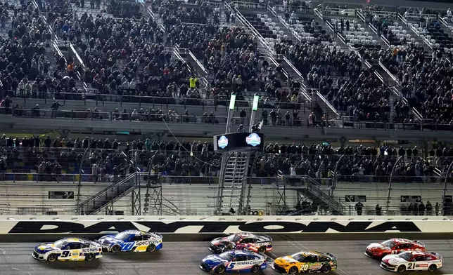 Chase Elliott, (9) wins the second of two NASCAR Daytona 500 qualifying auto races at Daytona International Speedway, Thursday, Feb. 12, 2026, in Daytona Beach, Fla. (AP Photo/Mike Stewart)