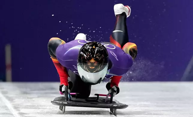 China's Lin Qinwei starts for a men's skeleton training session at the 2026 Winter Olympics, in Cortina d'Ampezzo, Italy, Monday, Feb. 9, 2026. (AP Photo/Alessandra Tarantino)