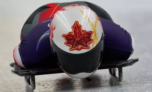 Canada's Hallie Clarke starts for a women's skeleton training session at the 2026 Winter Olympics, in Cortina d'Ampezzo, Italy, Tuesday, Feb. 10, 2026. (AP Photo/Aijaz Rahi)