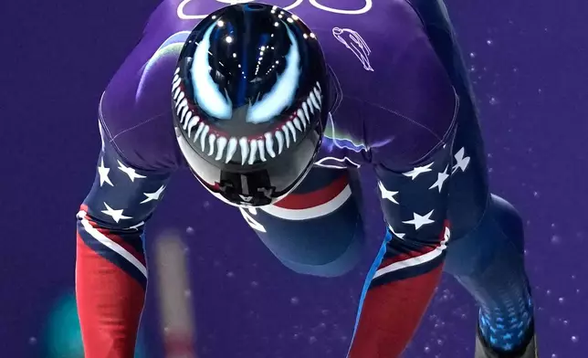 United State's Austin Florian starts for a men's skeleton training session at the 2026 Winter Olympics, in Cortina d'Ampezzo, Italy, Monday, Feb. 9, 2026. (AP Photo/Alessandra Tarantino)