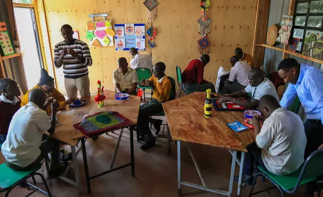 Pupils take part in an arts and crafts lesson at Rare Gem Talent School, which supports students with dyslexia, in Kitengela, Kajiado County, Kenya, Tuesday, Jan. 13, 2026. (AP Photo/Andrew Kasuku)