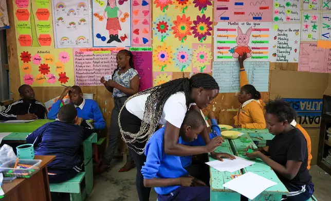 Pupils take part in an English lesson at Rare Gem Talent School, which supports students with dyslexia, in Kitengela, Kajiado County, Kenya, Tuesday, Jan. 13, 2026. (AP Photo/Andrew Kasuku)