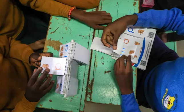 Pupils take part in an English lesson at Rare Gem Talent School, which supports students with dyslexia, in Kitengela, Kajiado County, Kenya, Tuesday, Jan. 13, 2026. (AP Photo/Andrew Kasuku)