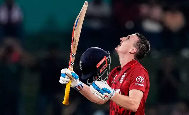 England's captain Harry Brook celebrates his century during the T20 World Cup cricket match between England and Pakistan in Pallekele, Sri Lanka, Tuesday, Feb. 24, 2026. (AP Photo/Eranga Jayawardena)