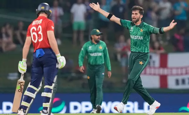 Pakistan's Shaheen Shah Afridi appeals unsuccessfully for the wicket of England's Jos Buttler, left, during the T20 World Cup cricket match between England and Pakistan in Pallekele, Sri Lanka, Tuesday, Feb. 24, 2026. (AP Photo/Eranga Jayawardena)