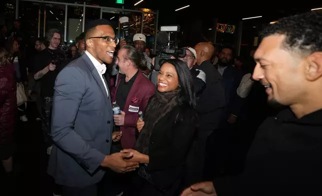 Texas Congressional Candidate Christian Menefee greets supporters during his watch party at The Post Houston on Election Day, in Houston, Saturday, Jan. 31, 2026. (AP Photo/ Karen Warren)
