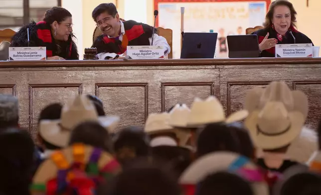 Members of the Mexican Supreme Court, Lenia Batres, from left, Hugo Aguilar and Yasmin Esquivel attend a special session with Indigenous communities of Chiapas State in Tenejapa, Mexico, Thursday, Feb. 26, 2026. (AP Photo/Isabel Mateos)