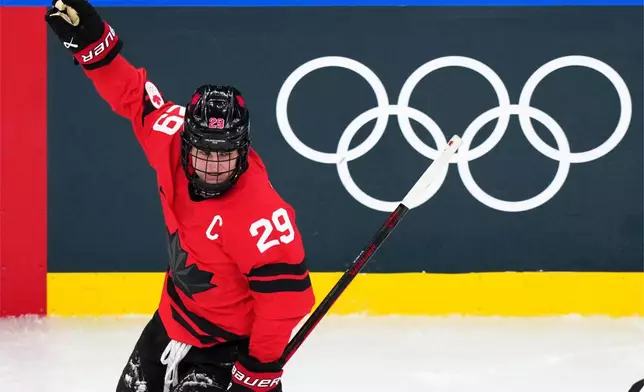 Canada's Marie-Philip Poulin celebrates after scoring her second goal of the game during the second period of a women's ice hockey semifinal match against Switzerland at the 2026 Winter Olympics, in Milan, Italy, Monday, Feb. 16, 2026. (AP Photo/Carolyn Kaster)