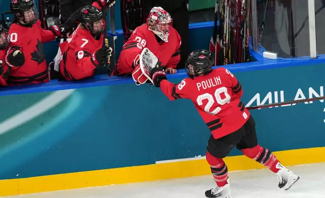 Canada's Marie-Philip Poulin (29) celebrates after scoring her first goal of the game against Switzerland during the second period of a women's ice hockey semifinal match at the 2026 Winter Olympics, in Milan, Italy, Monday, Feb. 16, 2026. (AP Photo/Carolyn Kaster)