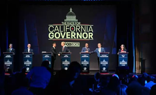 From left, Xavier Becerra, Steve Hilton, Matt Mahan, Tom Steyer, Tony Thurmond, Antonio Villaraigosa and Betty Yee stand on the stage during the California gubernatorial candidate debate Tuesday, Feb. 3, 2026, in San Francisco. (AP Photo/Laure Andrillon)