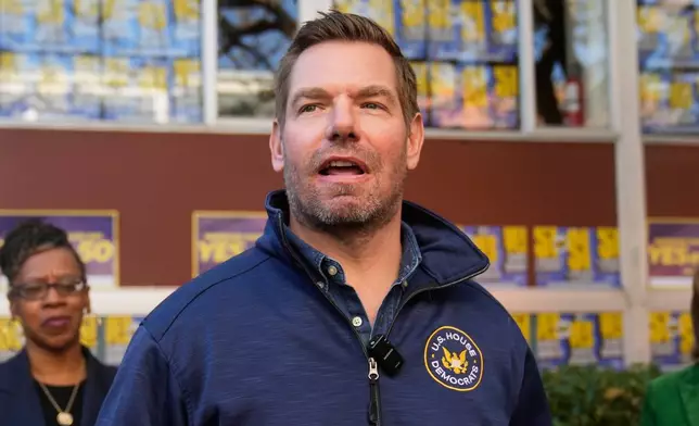 FILE - Rep. Eric Swalwell, D-Calif., speaks to reporters after a campaign event on Proposition 50 in San Francisco, Nov. 3, 2025. (AP Photo/Jeff Chiu, File)