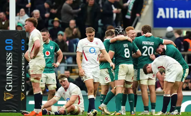 Ireland's players celebrate following the Six Nations rugby union match between England and Ireland in London, England, Saturday, Feb. 21, 2026. (AP Photo/Alastair Grant)