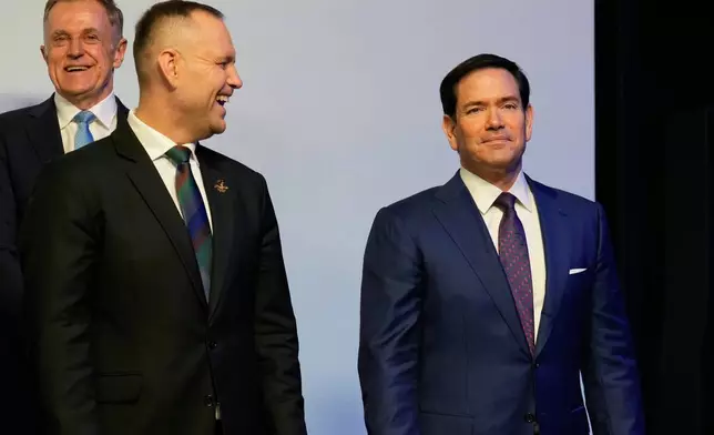 U.S. Secretary of State Marco Rubio, right, looks on ahead of a group photo at the Heads of states dinner, at the 2026 Winter Olympics, in Milan, Italy, Thursday, Feb. 5, 2026. (AP Photo/Luca Bruno, Pool)