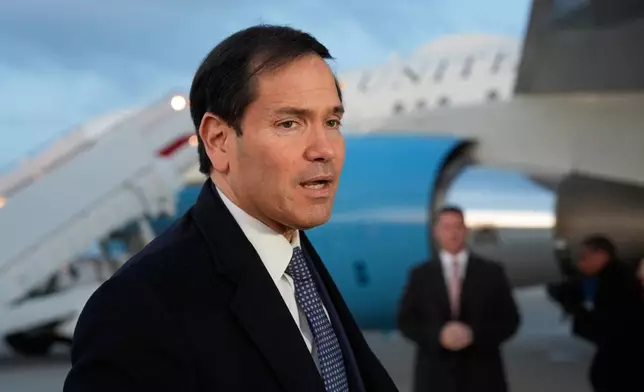 Secretary of State Marco Rubio speaks to reporters before boarding his plane, Thursday, Feb. 12, 2026, at Joint Base Andrews, Md., en route to the Munich Security Conference. (AP Photo/Alex Brandon, Pool)