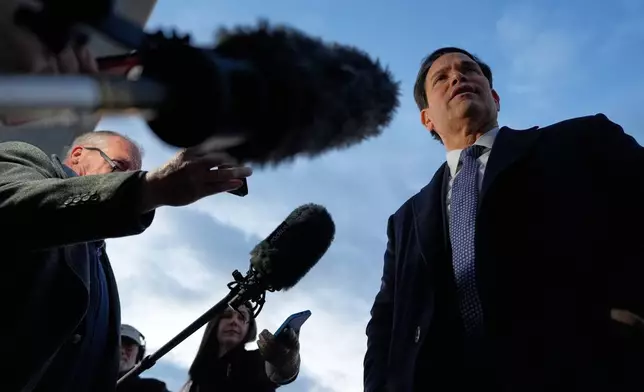Secretary of State Marco Rubio speaks to reporters before boarding his plane, Thursday, Feb. 12, 2026, at Joint Base Andrews, Md., en route to the Munich Security Conference. (AP Photo/Alex Brandon, Pool)