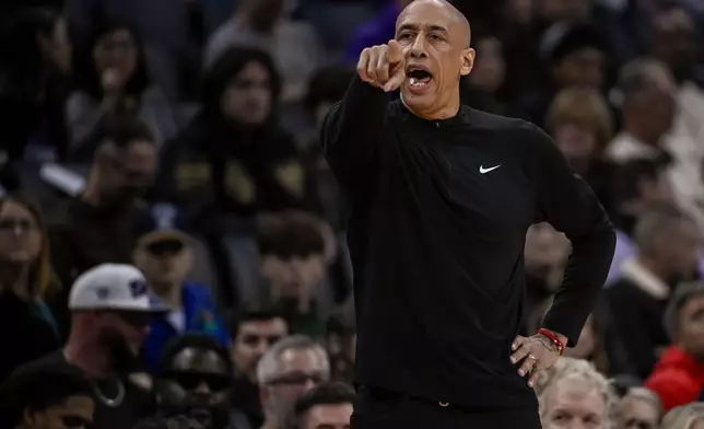 Sacramento Kings head coach Doug Christie shouts to his players during the first half of an NBA basketball game against the Orlando Magic in Sacramento, Calif., Thursday, Feb. 19, 2026. (AP Photo/Randall Benton)