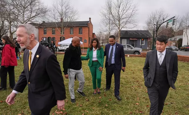 Rep. Jasmine Crockett, D-Texas, center, leaves following a press conference following the congressional deposition of Les Wexner in the Jeffery Epstein case, Wednesday, Feb. 18, 2026, in New Albany, Ohio. In foreground are Reps. Stephen Lynch, D-Mass., left, and David Min, D-Calif. (AP Photo/Joshua A. Bickel)