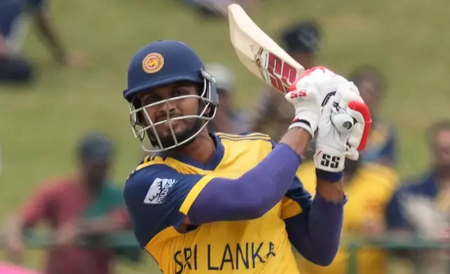 Sri Lanka's captain Dasun Shanaka plays a shot during the T20 World Cup cricket match between Oman and Sri Lanka in Pallekele, Sri Lanka, Thursday, Feb. 12, 2026. (AP Photo/Eranga Jayawardena)