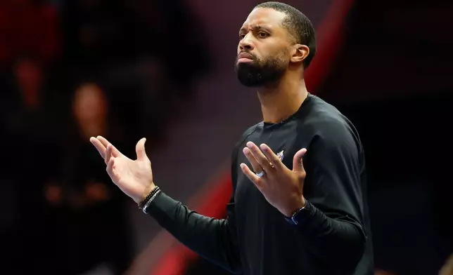 Charlotte Hornets head coach Charles Lee questions a call during the first half of an NBA basketball game against the San Antonio Spurs in Charlotte, N.C., Saturday, Jan. 31, 2026. (AP Photo/Nell Redmond)