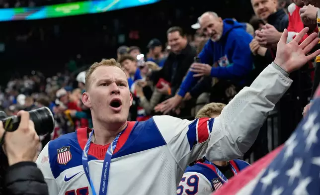 United States' Brady Tkachuk (7) celebrates after the United States defeated Canada in a men's ice hockey gold medal game between Canada and the United States at the 2026 Winter Olympics, in Milan, Italy, Sunday, Feb. 22, 2026. (AP Photo/Petr David Josek)