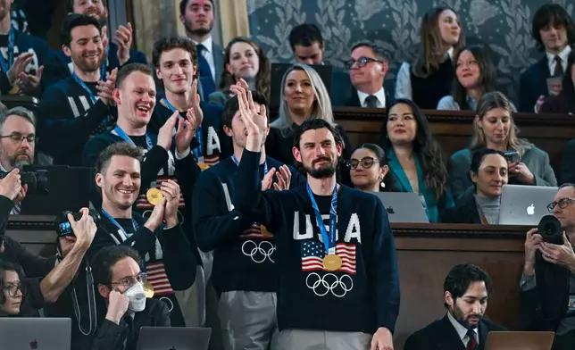 Members of the United States' Olympic gold medal hockey team enter the gallery as President Donald Trump delivers the State of the Union address to a joint session of Congress in the House chamber of the U.S. Capitol in Washington, Tuesday, Feb. 24, 2026. (Kenny Holston/The New York Times via AP, Pool)