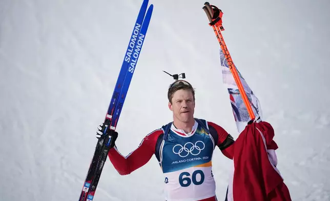 Vetle Sjaastad Christiansen, of Norway, reacts in the finish area of the men's 10-kilometer sprint biathlon race at the 2026 Winter Olympics in Anterselva, Italy, Friday, Feb. 13, 2026. (AP Photo/Andrew Medichini)