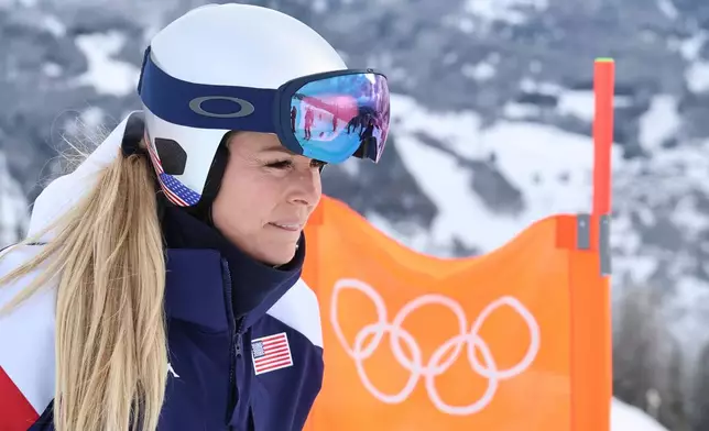 United States' Lindsey Vonn concentrates ahead of an alpine ski, women's downhill official training, at the 2026 Winter Olympics, in Cortina d'Ampezzo, Italy, Friday, Feb. 6, 2026. (AP Photo/Marco Trovati)