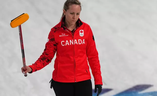 Canada's Rachel Homan, in action during the women's curling round robin session against Switzerland at the 2026 Winter Olympics, in Cortina d'Ampezzo, Italy, Saturday, Feb.14, 2026. (AP Photo/Fatima Shbair)