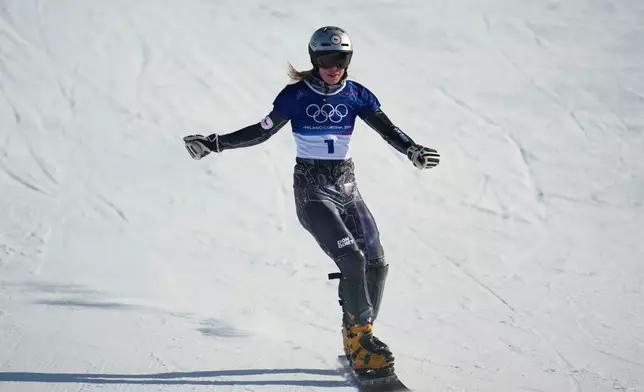 Czechia's Ester Ledecka reacts after finishing behind Austria's Sabine Payer during the women's snowboarding parallel giant slalom finals at the 2026 Winter Olympics, in Livigno, Italy, Sunday, Feb. 8, 2026. (AP Photo/Abbie Parr)
