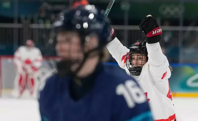 Canada's Kristin O'Neill celebrates after scoring her side's third goal during a preliminary round match of women's ice hockey between Finland and Canada at the 2026 Winter Olympics, in Milan, Italy, Thursday, Feb. 12, 2026. (AP Photo/Hassan Ammar)