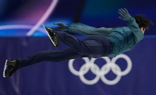 Kyrylo Marsak of Ukraine competes during the men's figure skating short program at the 2026 Winter Olympics, in Milan, Italy, Tuesday, Feb. 10, 2026. (AP Photo/Ashley Landis)