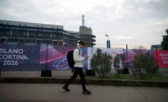 Ukrainian figure skater Kyrylo Marsak walks outside the Milan ice skating arena on his way to practice his routine, at the 2026 Winter Olympics, in Milan, Italy, Sunday, Feb. 8, 2026. (AP Photo/Vasilisa Stepanenko)