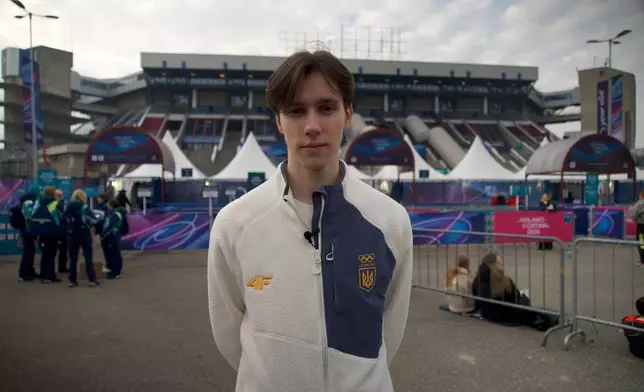 Ukrainian figure skater Kyrylo Marsak poses for a photo outside the Milan ice skating arena on his way to practice his routine, at the 2026 Winter Olympics, in Milan, Italy, Sunday, Feb. 8, 2026. (AP Photo/Vasilisa Stepanenko)