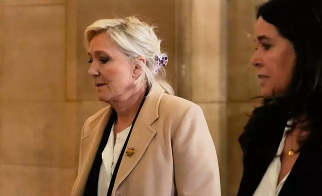 Far-right leader Marine Le Pen arrives for her appeal trial, in Paris, France, Wednesday, Feb. 11, 2026. (AP Photo/Michel Euler)