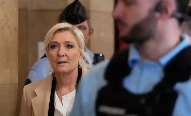 Far-right leader Marine Le Pen arrives for her appeal trial, in Paris, France, Wednesday, Feb. 11, 2026. (AP Photo/Michel Euler)