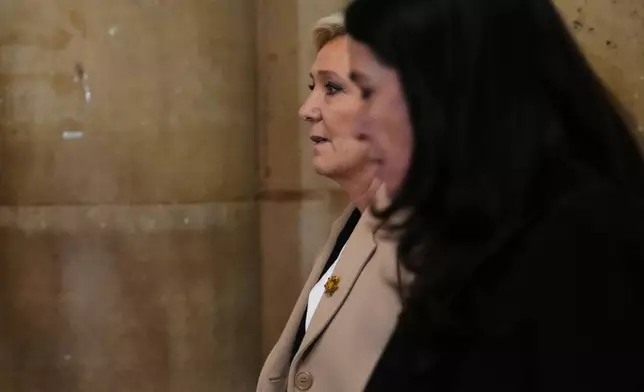 Far-right leader Marine Le Pen arrives for her appeal trial, in Paris, France, Wednesday, Feb. 11, 2026. (AP Photo/Aurelien Morissard)