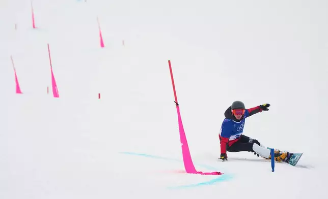 Bulgaria's Alexander Krashniak practices during a snowboard parallel giant slalom training session at the 2026 Winter Olympics, in Livigno, Italy, Friday, Feb. 6, 2026. (AP Photo/Gregory Bull)