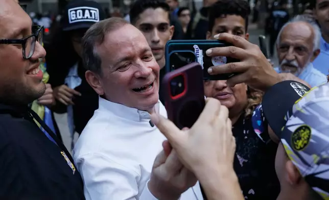 Opposition leader Juan Pablo Guanipa records a video message to supporters after his release from prison in Caracas, Venezuela, Sunday, Feb. 8, 2026. (AP Photo/Cristian Hernandez)