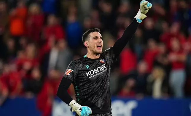 Osasuna's goalkeeper Sergio Herrera celebrates at the end of the Spanish La Liga soccer match between Osasuna and Real Madrid in Pamplona, Spain, Saturday, Feb. 21, 2026. (AP Photo/Miguel Oses)