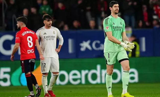 Real Madrid's goalkeeper Thibaut Courtois reacts during a Spanish La Liga soccer match between Osasuna and Real Madrid in Pamplona, Spain, Saturday, Feb. 21, 2026. (AP Photo/Miguel Oses)
