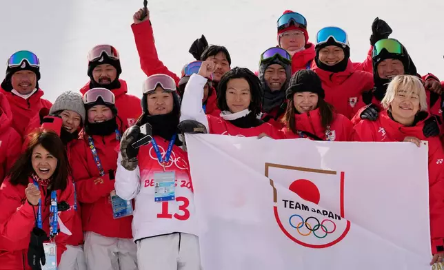 FILE - Japan's Ayumu Hirano poses for pictures after winning a gold medal in the men's halfpipe finals at the 2022 Winter Olympics, Friday, Feb. 11, 2022, in Zhangjiakou, China. (AP Photo/Francisco Seco, File)