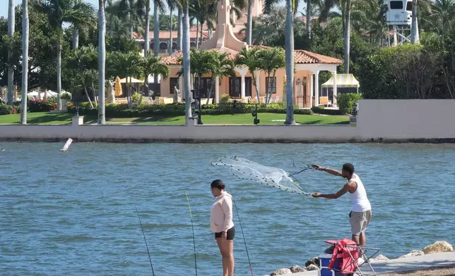 A fisherman casts his neat near Mar-a-Lago Sunday, Feb. 22, 2026, in Palm Beach, Fla. The U.S. Secret Service announced Sunday that an armed man was shot and killed after entering the secure perimeter of Mar-a-Lago, President Donald Trump's resort. (AP Photo/Marta Lavandier)