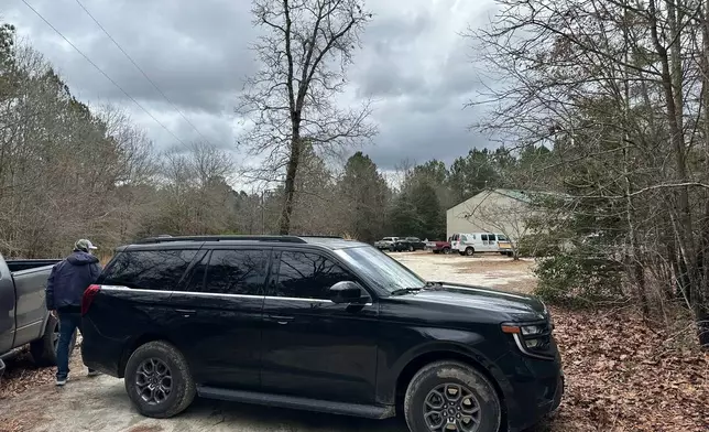 A vehicle blocks access to a property in Cameron, N.C., Sunday, Feb. 22, 2026. (AP Photo/Allen G. Breed)