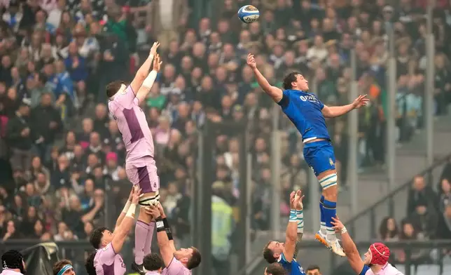 Italy's Michele Lamaro, right, and Scotland's Scott Cummings go airborn during the Six Nations rugby match between Italy and Scotland at Rome's Olympic Stadium, Saturday, Feb. 7, 2026. (AP Photo/Gregorio Borgia)