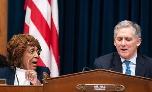 House Financial Services Committee Ranking Member Maxine Waters D-Calif., speaks with Chair French Hill R-Ark., during hearing featuring Secretary of the Treasury Scott Bessent on Capitol Hill in Washington, Wednesday, Feb. 4, 2026. (AP Photo/Nathan Howard)