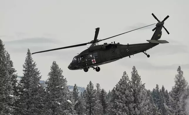 A U.S. Army Blackhawk helicopter takes off from the Truckee Tahoe Airport as recovery efforts for a group of missing skiers continue, continue in Truckee, Calif., Saturday, Feb. 21, 2026. (AP Photo/Godofredo A. Vásquez)